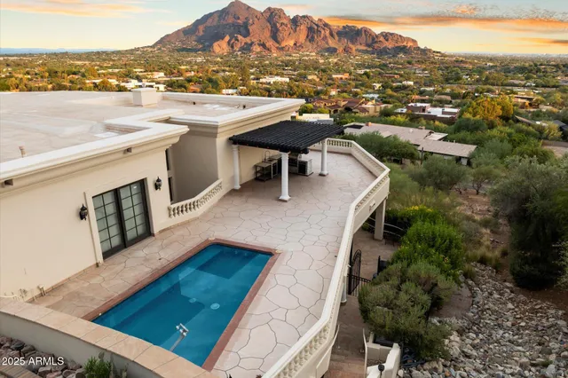 a large white kitchen with a sink dishwasher stove and refrigerator