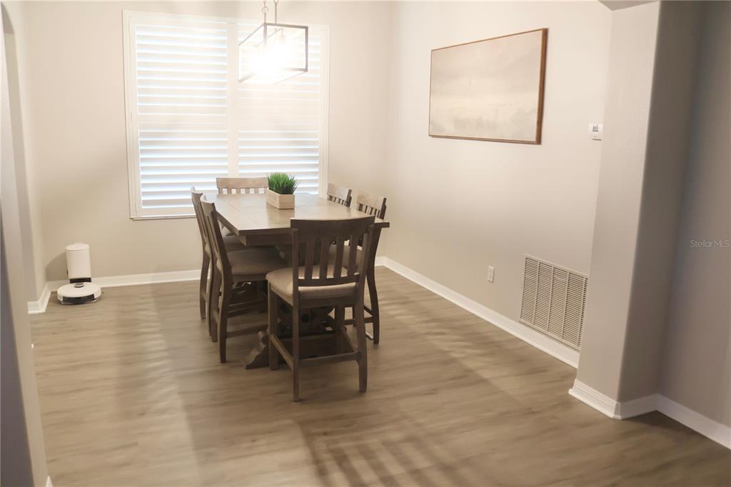 3850 Beacon Ridge Way Clermont, FL 34711 - Photo 36 of 41 a dining room with furniture and window
