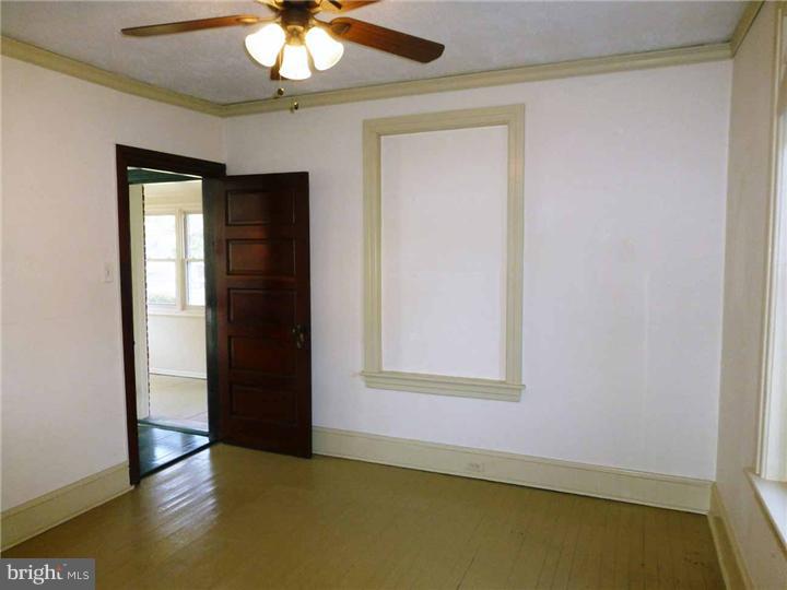 68 Bethel Church Road Spring City, PA 19475 - Photo 11 of 23 an empty room with a window and chandelier fan