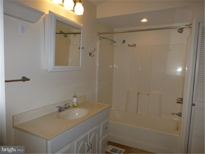 68 Bethel Church Road Spring City, PA 19475 - Photo 15 of 23 a bathroom with a shower sink vanity and mirror
