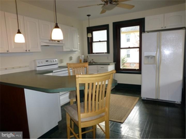 68 Bethel Church Road Spring City, PA 19475 - Photo 18 of 23 a kitchen with stainless steel appliances granite countertop a sink a stove a dining table and chairs