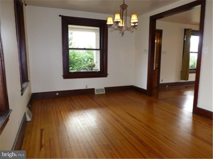 68 Bethel Church Road Spring City, PA 19475 - Photo 10 of 23 an empty room with wooden floor and windows