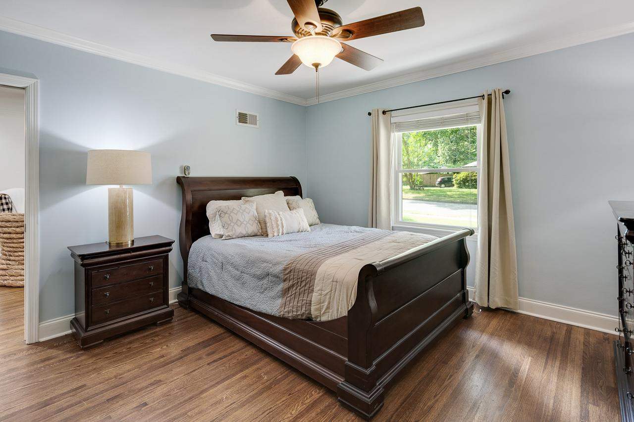 1057 Dearing Road Memphis, TN 38117 - Photo 7 of 25 The home has a split bedroom plan, with the primary away from the other two bedrooms. It also has a walk-in closet with a pocket door!
