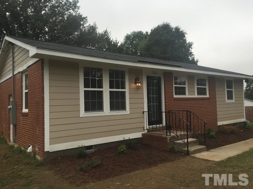 722 Newcombe Road Raleigh, NC 27610 - Photo 1 of 19 a front view of a house with a yard