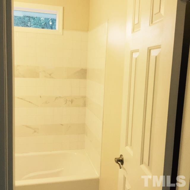 722 Newcombe Road Raleigh, NC 27610 - Photo 12 of 19 a bathroom with a bathtub