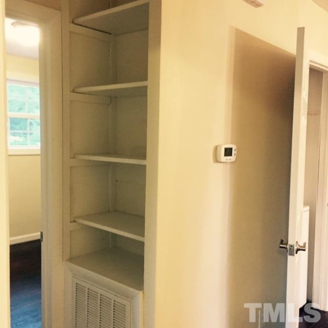 722 Newcombe Road Raleigh, NC 27610 - Photo 14 of 19 a close view of walk in closet with empty racks