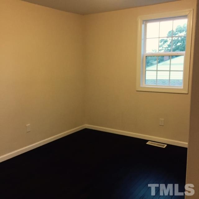 722 Newcombe Road Raleigh, NC 27610 - Photo 15 of 19 an empty room with a window