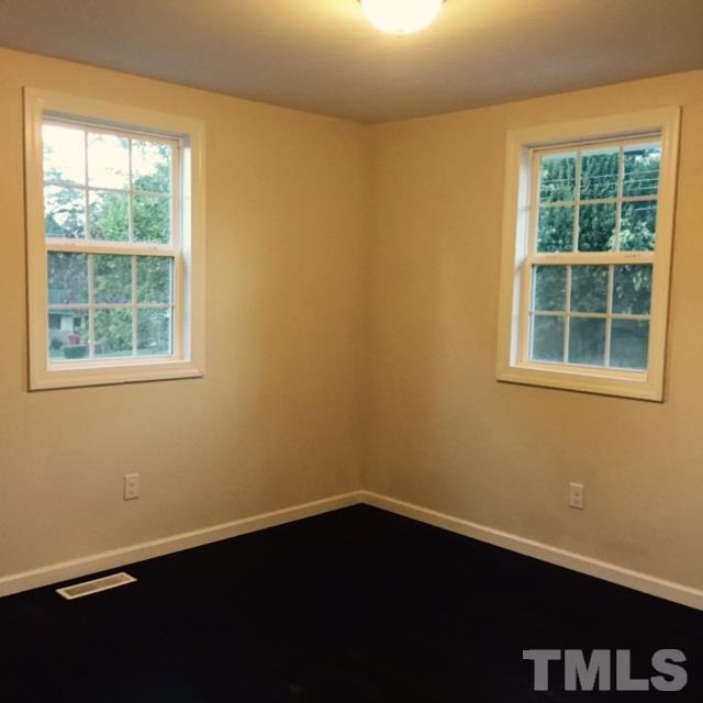 722 Newcombe Road Raleigh, NC 27610 - Photo 16 of 19 an empty room with a window