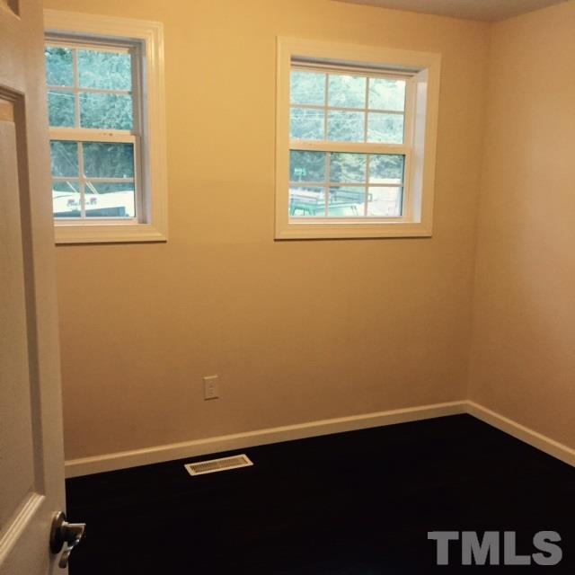 722 Newcombe Road Raleigh, NC 27610 - Photo 17 of 19 an empty room with a window