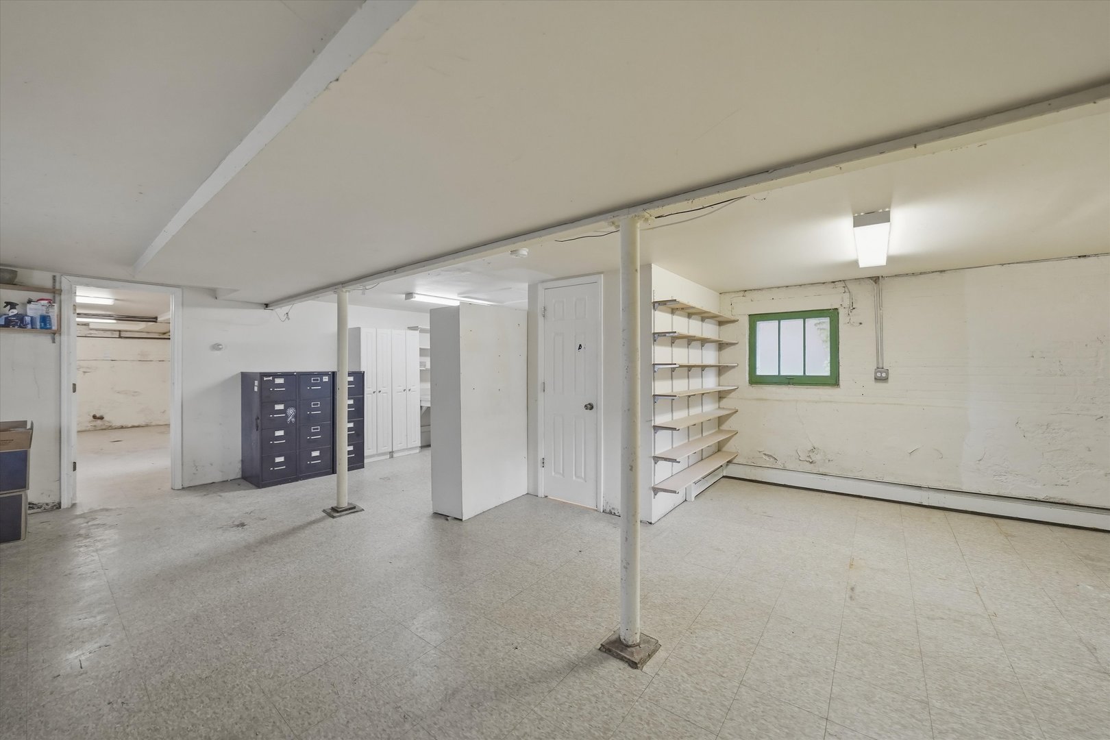 3100 Clinton Avenue Berwyn, IL 60402 - Photo 18 of 25 an empty room with a cabinet and mirrors
