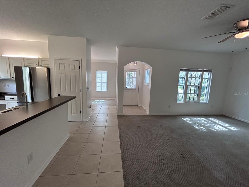 904 Pawstand Road Kissimmee, FL 34747 - Photo 15 of 22 a view of a hallway with a living room