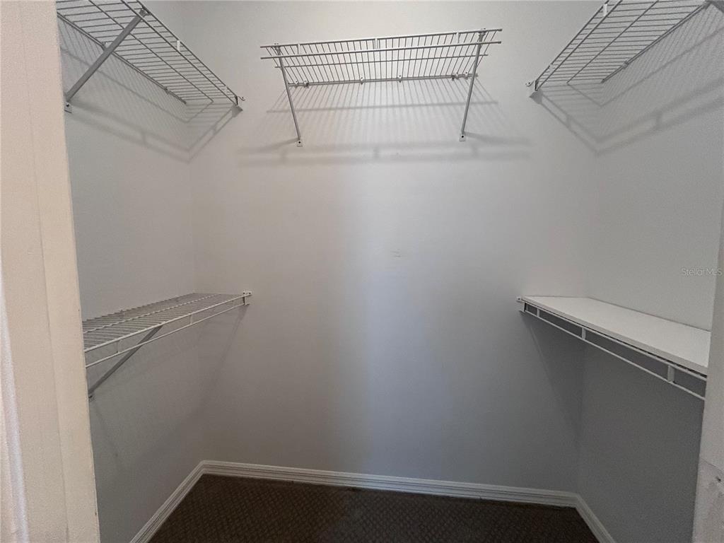 904 Pawstand Road Kissimmee, FL 34747 - Photo 20 of 22 a view of a room with racks on the wall