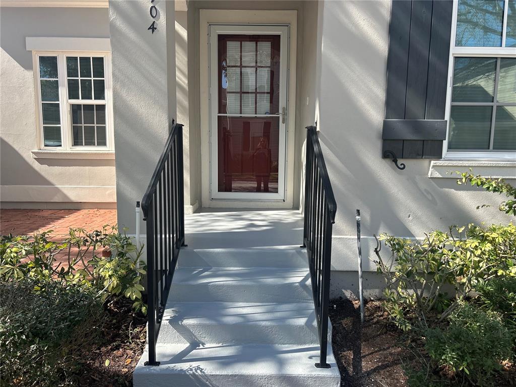 904 Pawstand Road Kissimmee, FL 34747 - Photo 2 of 22 a front view of a house with a tree