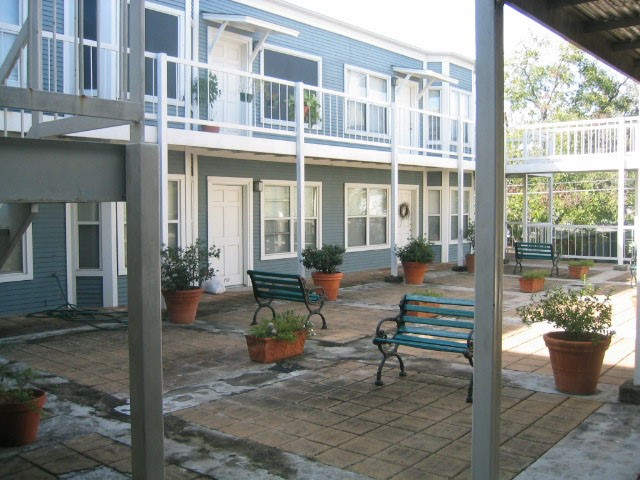 a view of a building with sitting area