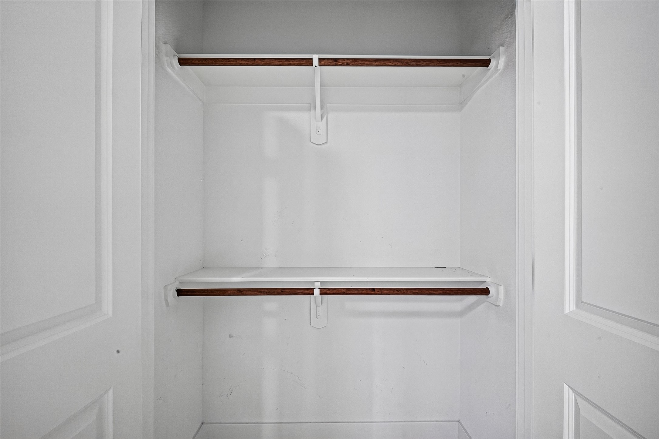 5027 Dickens Road, Unit B Houston, TX 77021 - Photo 23 of 24 Built-in closet system with dual-level hanging space and integrated shelving.