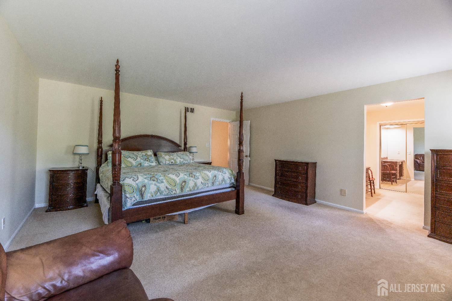 5 Pine Ridge Drive Edison, NJ 08820 - Photo 20 of 45 a bedroom with a bed and a couch