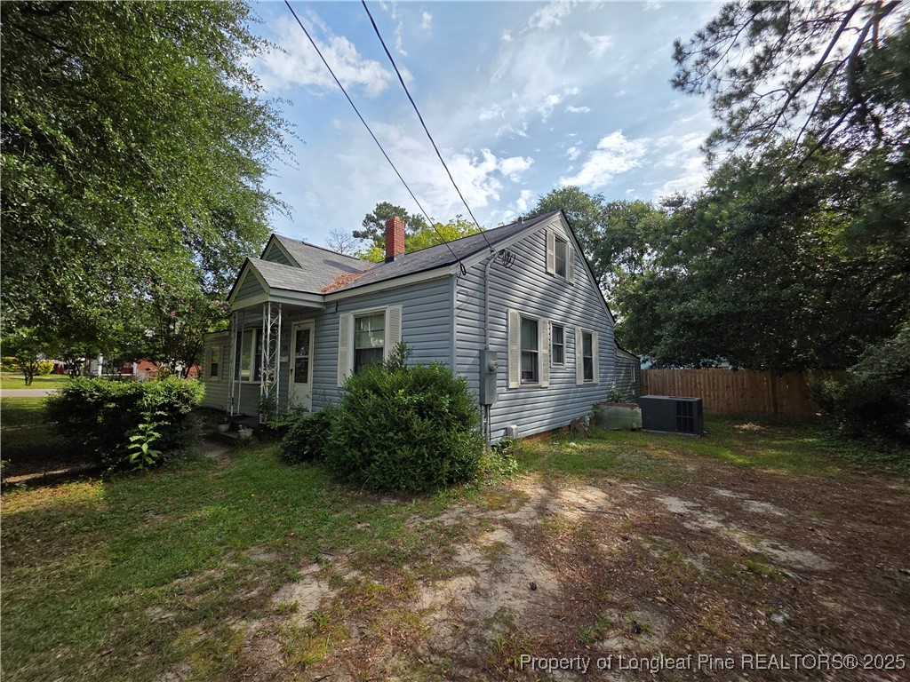 124 North Wright Street Raeford, NC 28376 - Photo 13 of 17 a view of a house with a yard and pathway