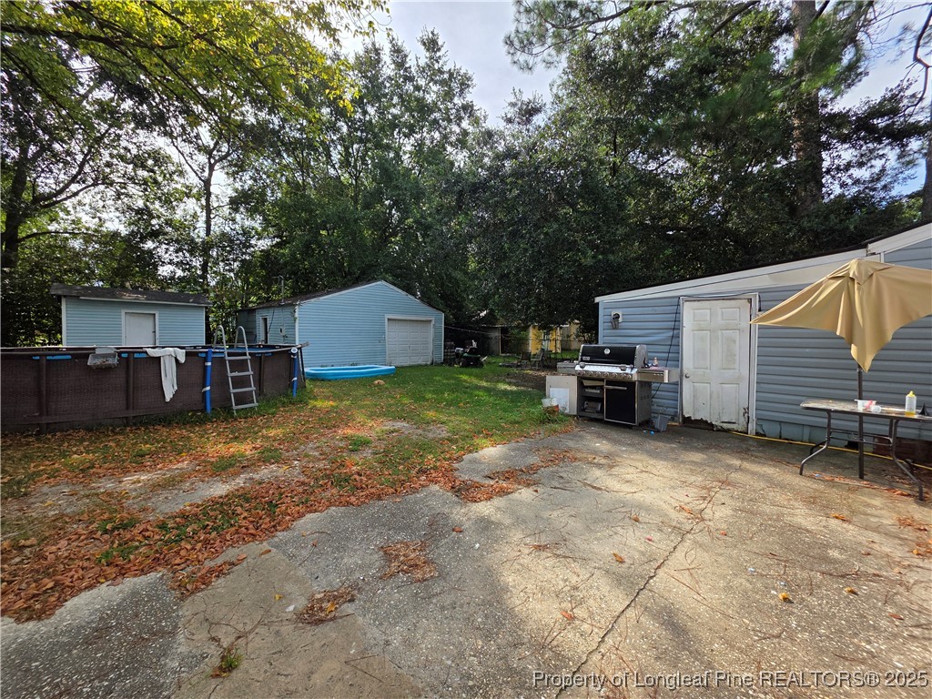 124 North Wright Street Raeford, NC 28376 - Photo 16 of 17 a view of a house with a yard and furniture