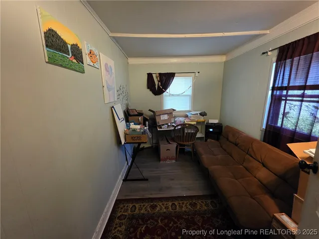 a living room with furniture and a rug