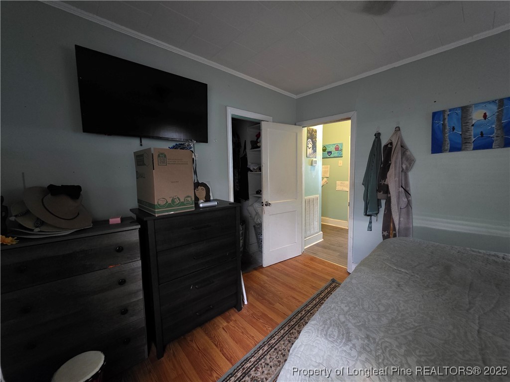 124 North Wright Street Raeford, NC 28376 - Photo 6 of 17 a living room with furniture and a flat screen tv