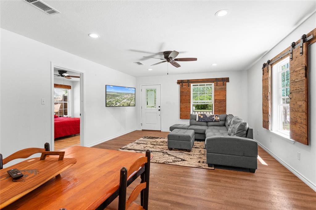 900 Bosque Street Meridian, TX 76665 - Photo 12 of 30 a living room with furniture and a wooden floor