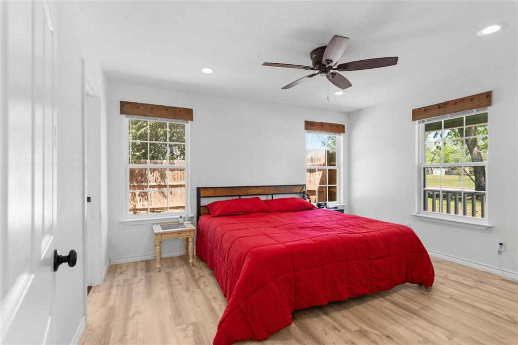 900 Bosque Street Meridian, TX 76665 - Photo 14 of 30 a bedroom with a large bed and a window
