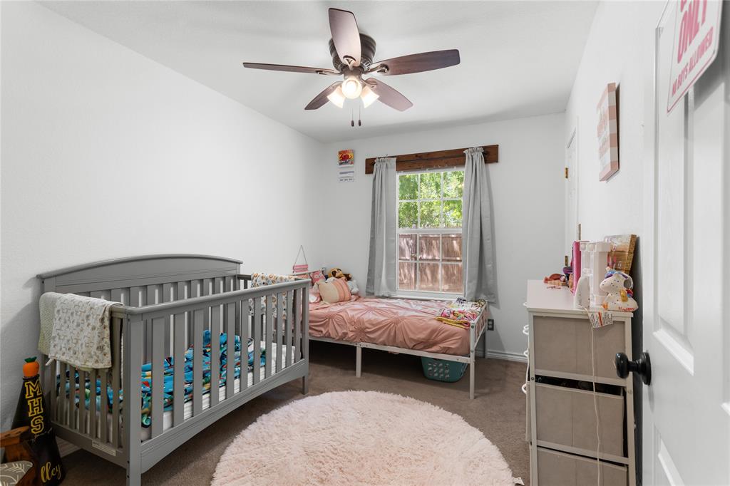 900 Bosque Street Meridian, TX 76665 - Photo 17 of 30 a bedroom with a bed and a window