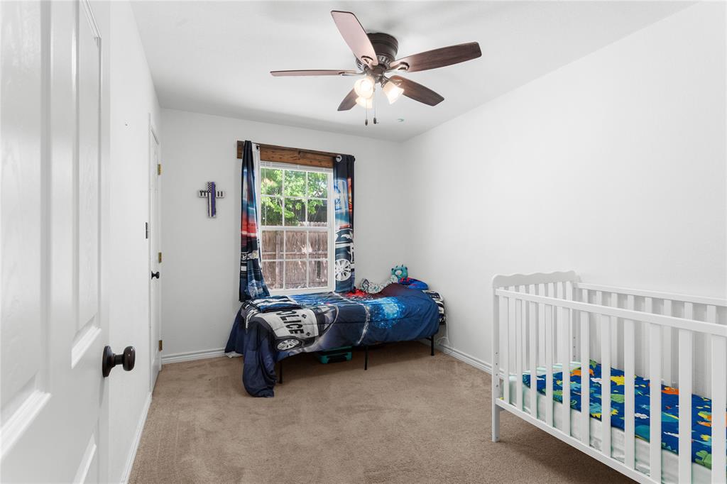 900 Bosque Street Meridian, TX 76665 - Photo 19 of 30 a bedroom with furniture and a window