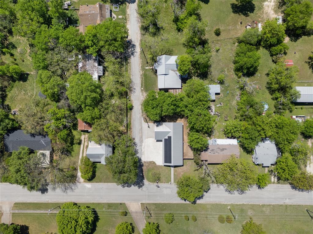 900 Bosque Street Meridian, TX 76665 - Photo 29 of 30 an aerial view of a house with lots of trees