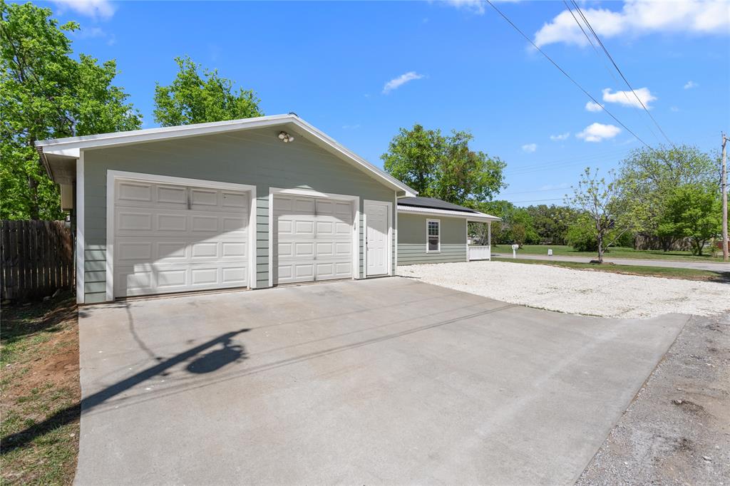 900 Bosque Street Meridian, TX 76665 - Photo 5 of 30 a backyard of a house with garage and garage
