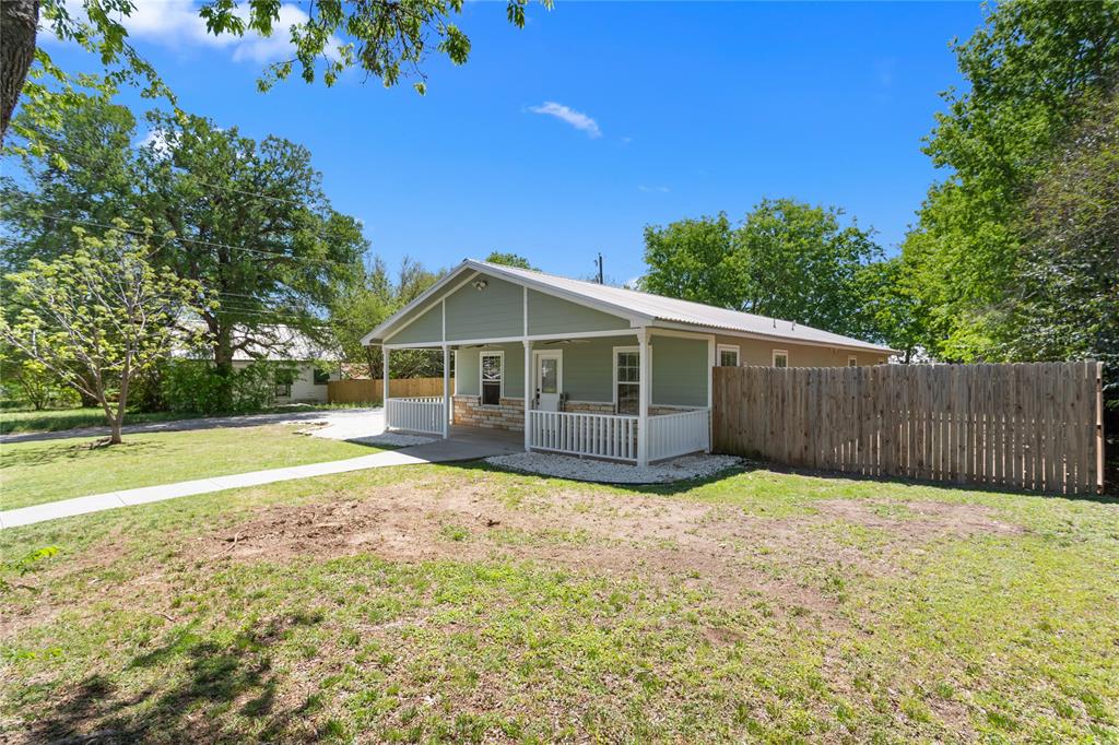 900 Bosque Street Meridian, TX 76665 - Photo 6 of 30 a view of a house with a yard