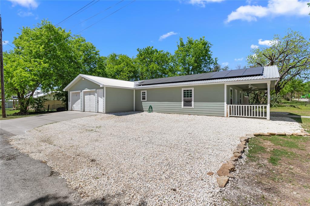 900 Bosque Street Meridian, TX 76665 - Photo 7 of 30 a house with trees in the background