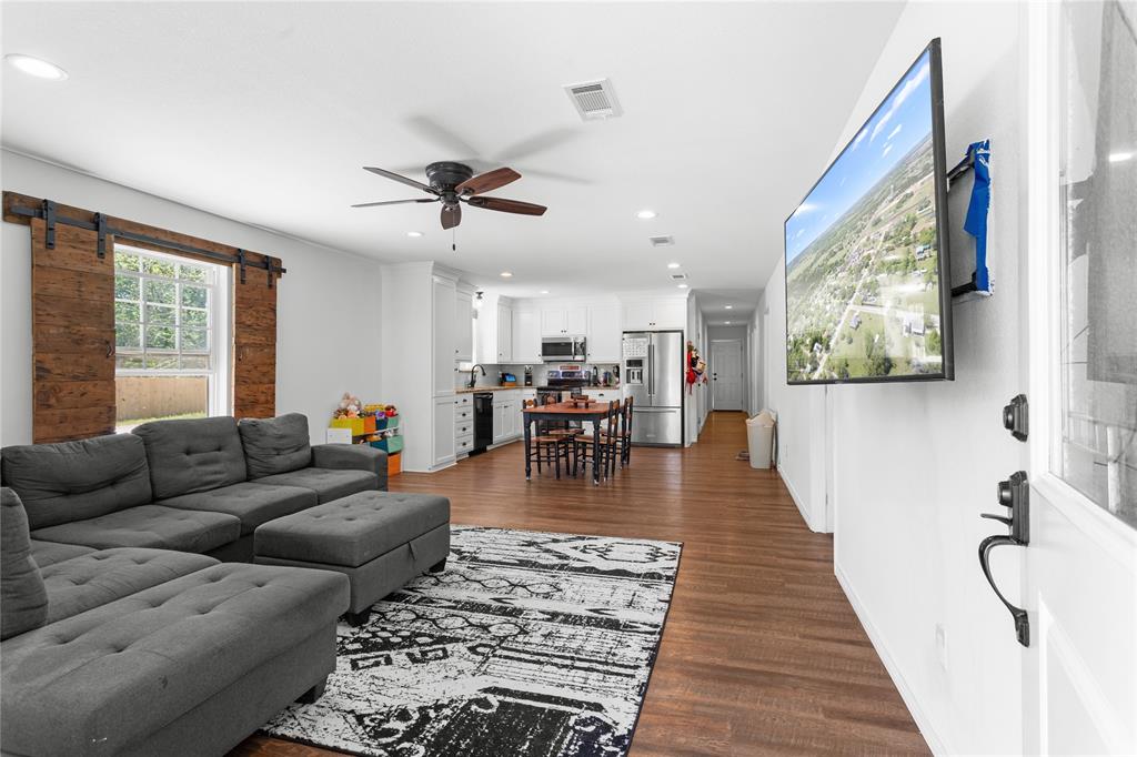 900 Bosque Street Meridian, TX 76665 - Photo 10 of 30 a living room with furniture and wooden floor
