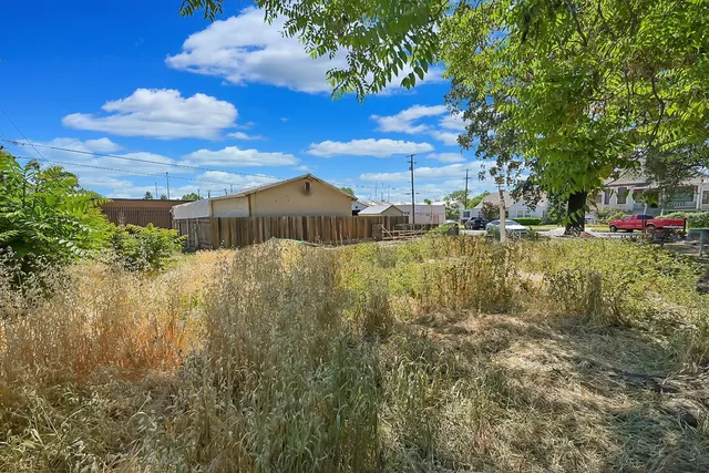 a view of a lake with a house in the background