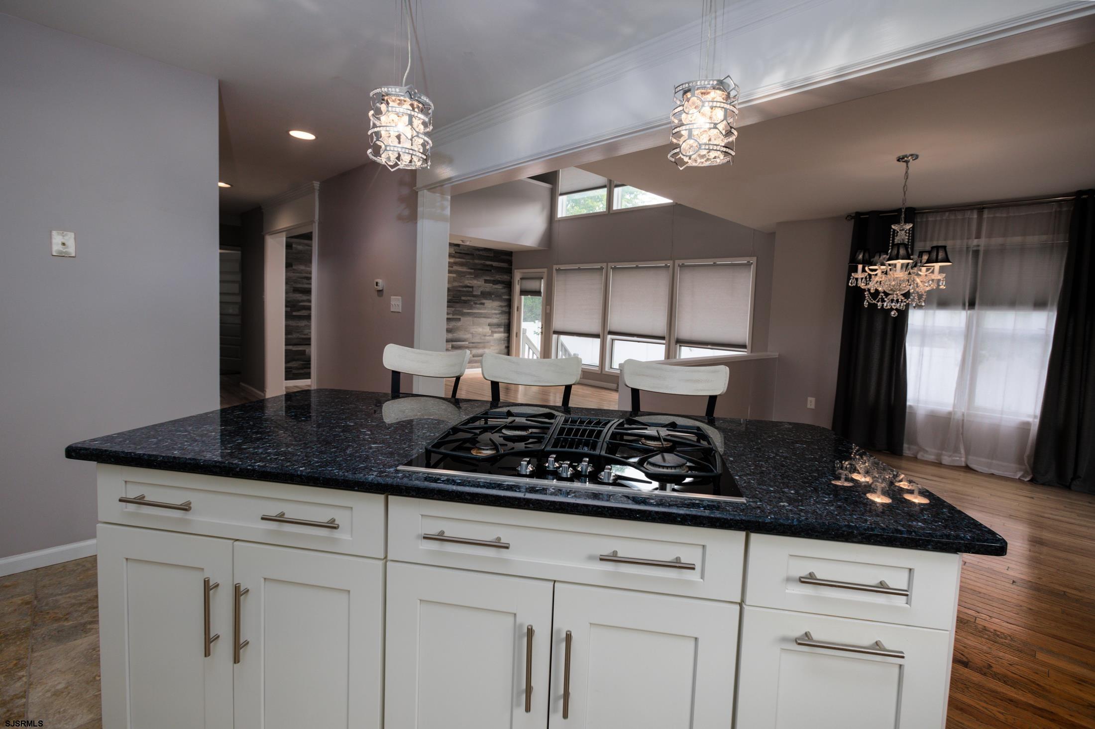 816 Chelsea Road Absecon, NJ 08201 - Photo 13 of 41 a kitchen with stainless steel appliances a counter space a sink and cabinets