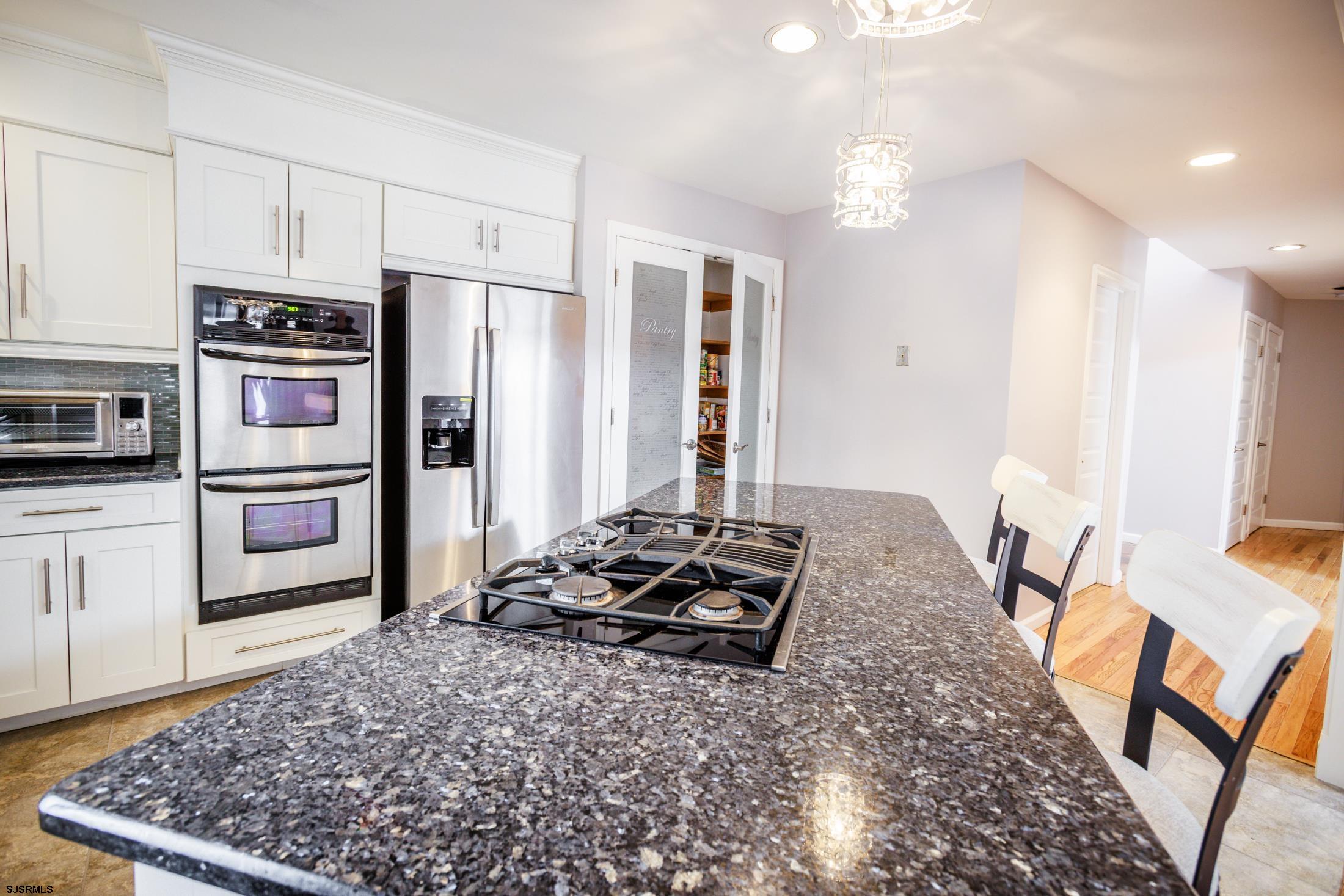 816 Chelsea Road Absecon, NJ 08201 - Photo 14 of 41 a kitchen with stainless steel appliances granite countertop a refrigerator stove oven and a sink