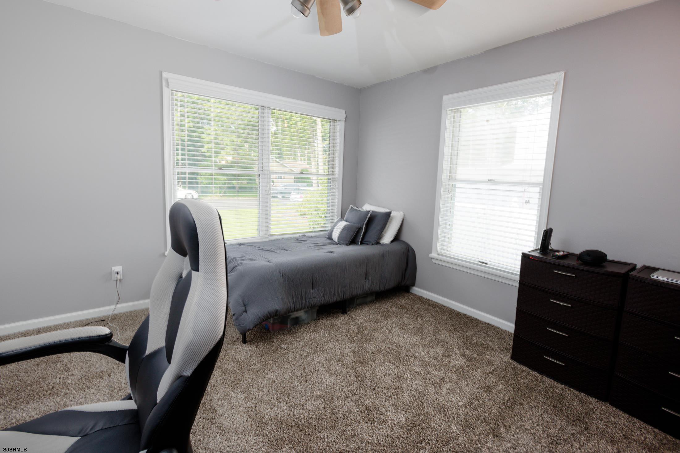816 Chelsea Road Absecon, NJ 08201 - Photo 17 of 41 a bedroom with a bed and a window