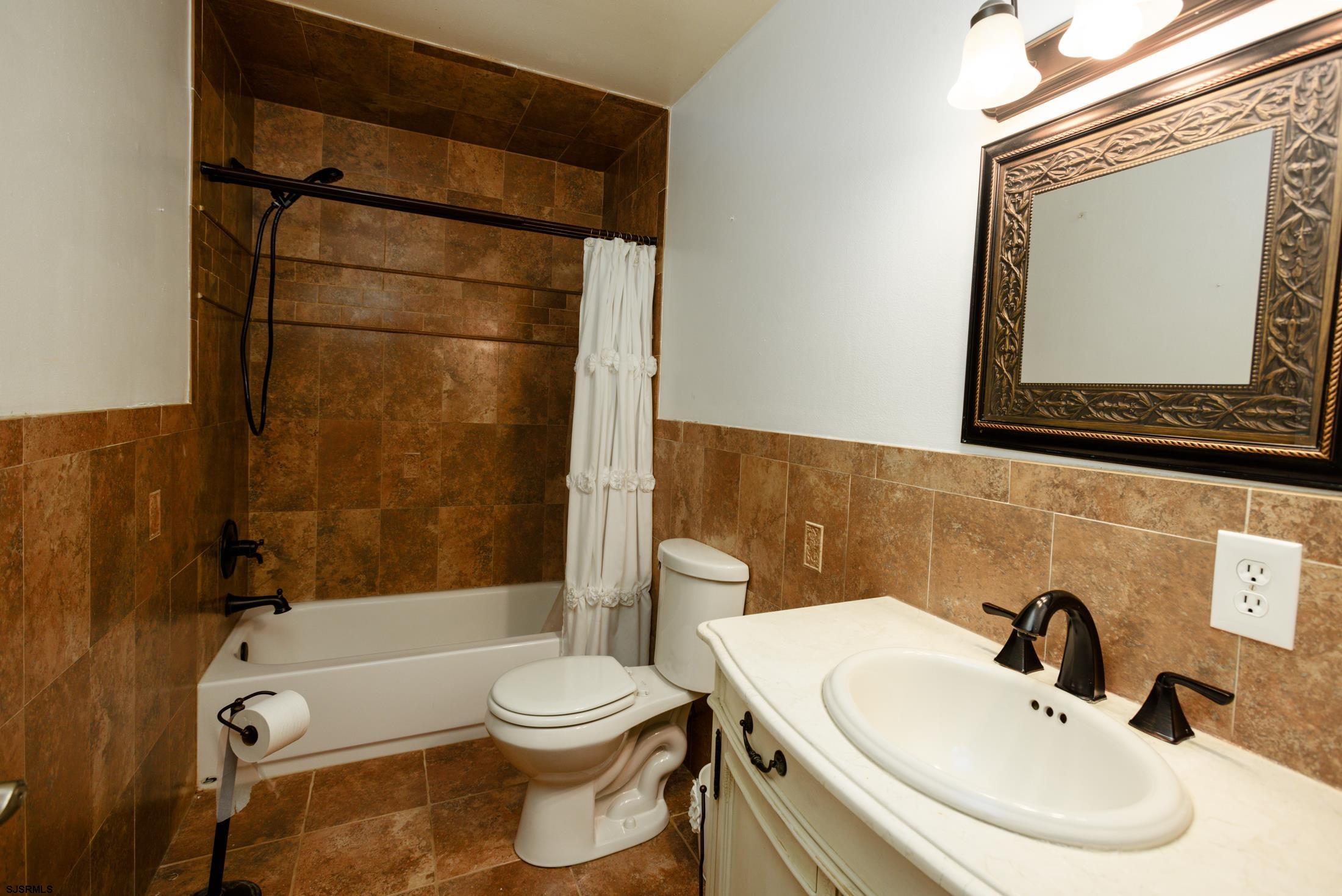 816 Chelsea Road Absecon, NJ 08201 - Photo 20 of 41 a bathroom with a sink toilet and shower