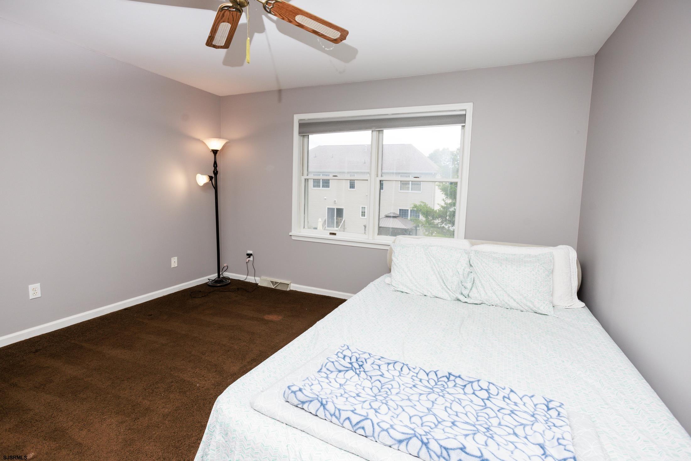 816 Chelsea Road Absecon, NJ 08201 - Photo 23 of 41 a large white bed in a white room
