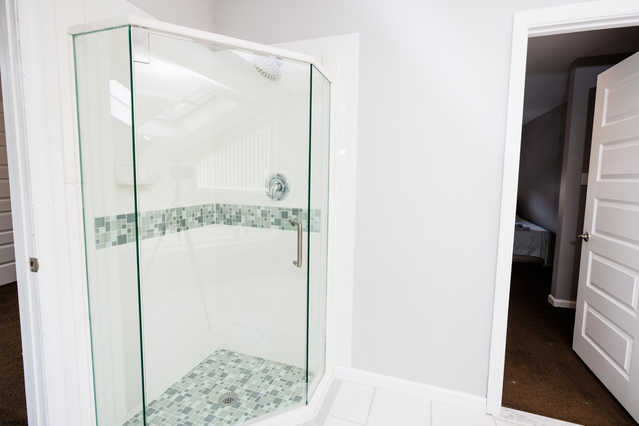 816 Chelsea Road Absecon, NJ 08201 - Photo 26 of 41 a bathroom with a glass shower door