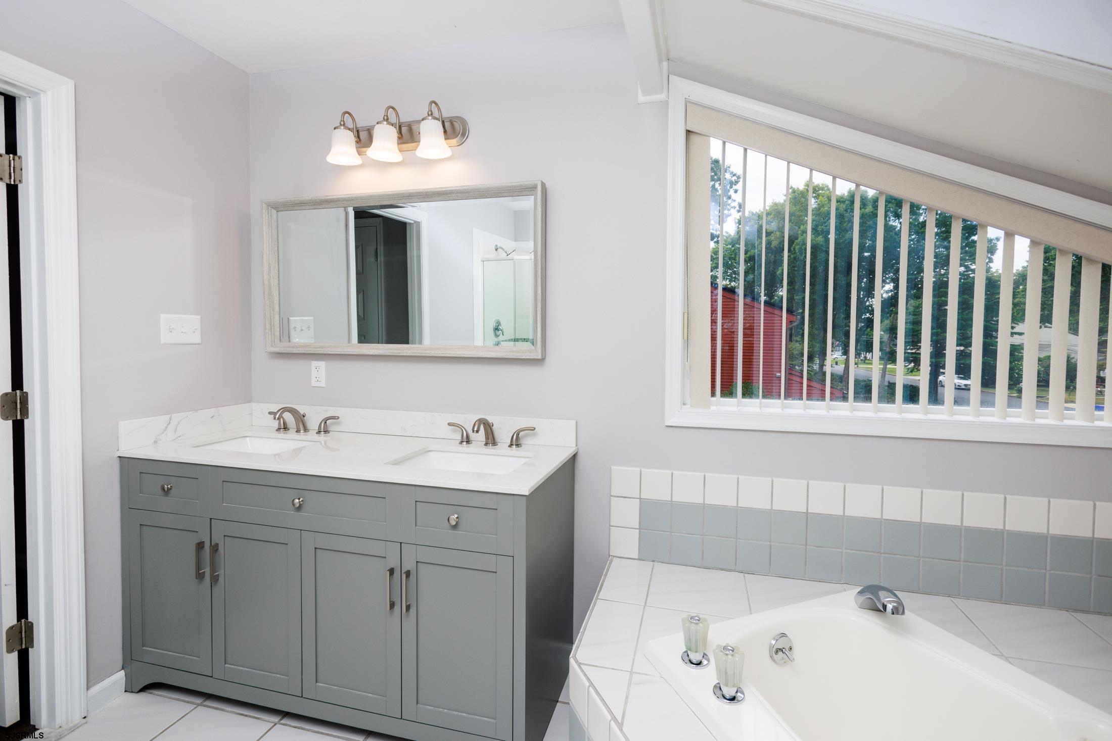 816 Chelsea Road Absecon, NJ 08201 - Photo 28 of 41 a bathroom with a sink and a bathtub