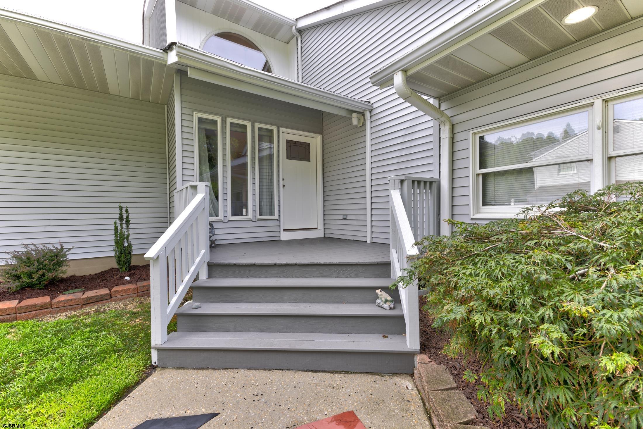 816 Chelsea Road Absecon, NJ 08201 - Photo 3 of 41 a view of a house with wooden fence and large windows