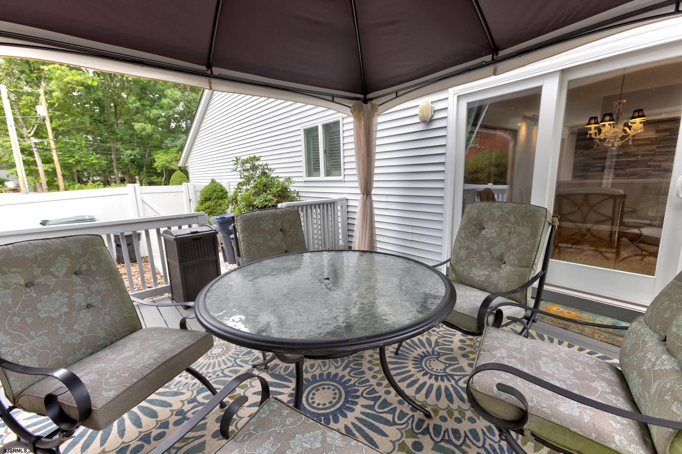 816 Chelsea Road Absecon, NJ 08201 - Photo 32 of 41 a view of a patio with table and chairs