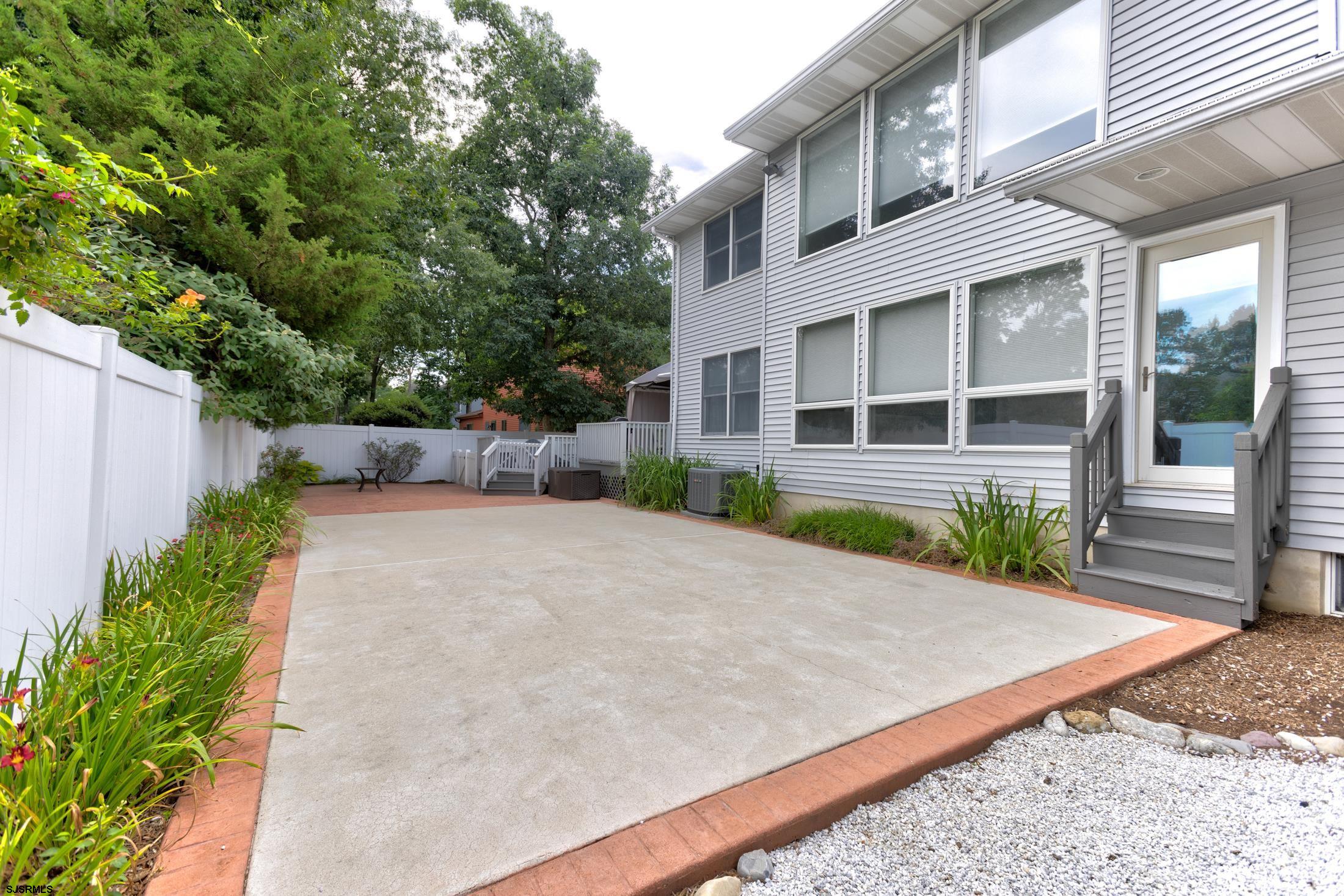 816 Chelsea Road Absecon, NJ 08201 - Photo 35 of 41 a front view of a house with a yard and potted plants