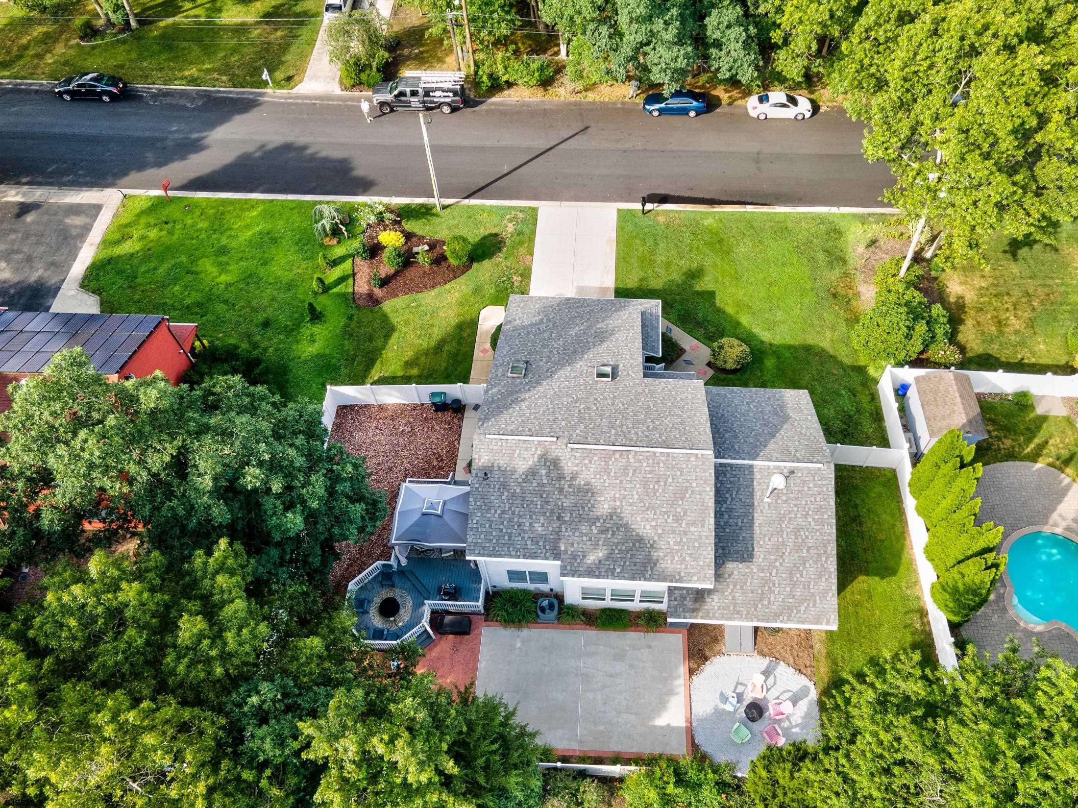816 Chelsea Road Absecon, NJ 08201 - Photo 5 of 41 an aerial view of a house with a garden and a yard