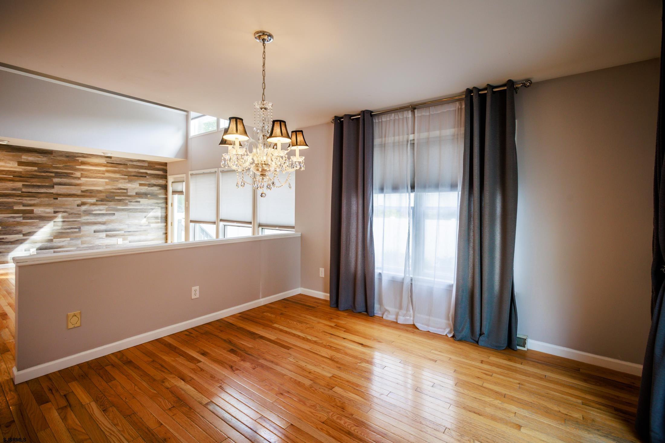 816 Chelsea Road Absecon, NJ 08201 - Photo 9 of 41 a view of a room with window wooden floor and front door