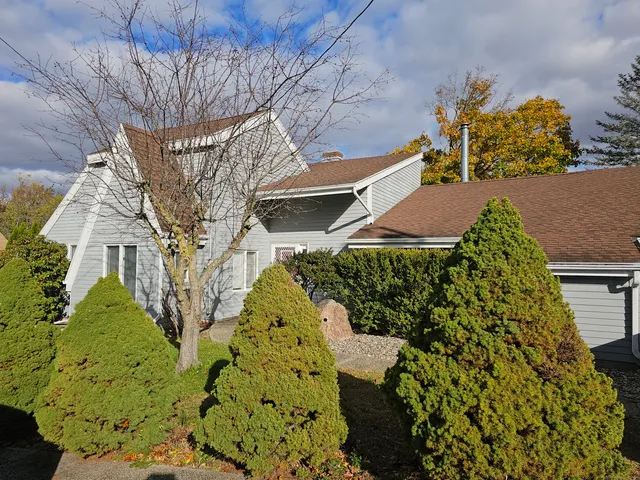 a aerial view of a house with a yard and garden