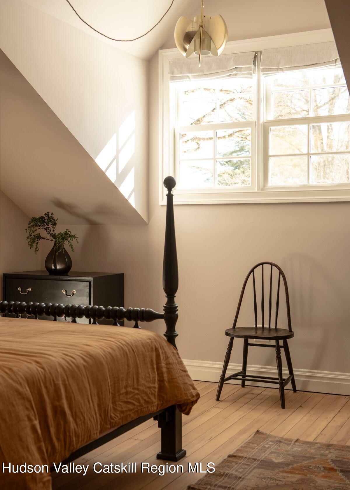 401 Buck Road Stone Ridge, NY 12484 - Photo 20 of 32 a bedroom with a bed and a window