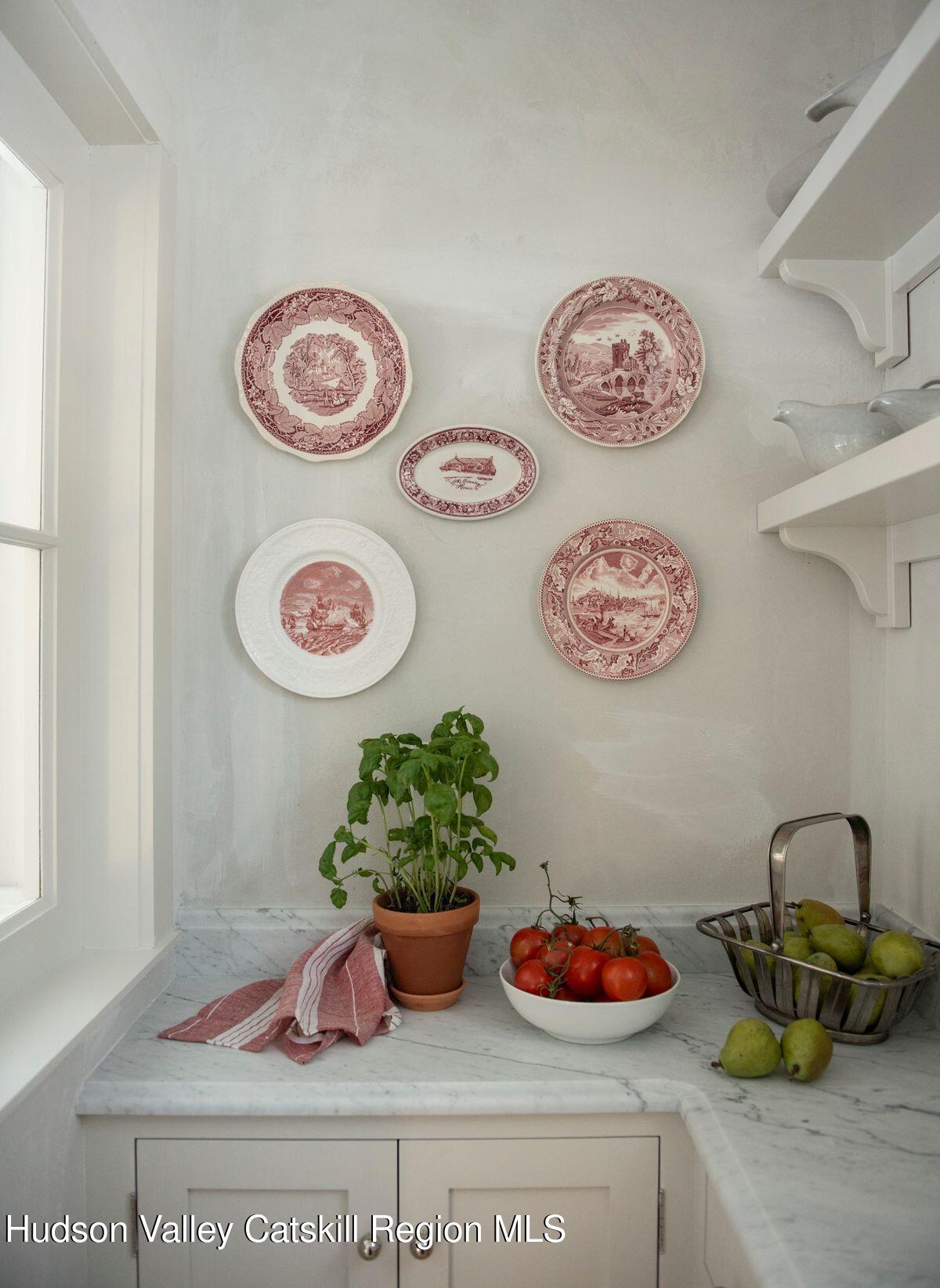 401 Buck Road Stone Ridge, NY 12484 - Photo 9 of 32 a table with a vase and flowers on it