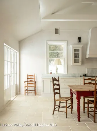 a view of a livingroom with furniture and window